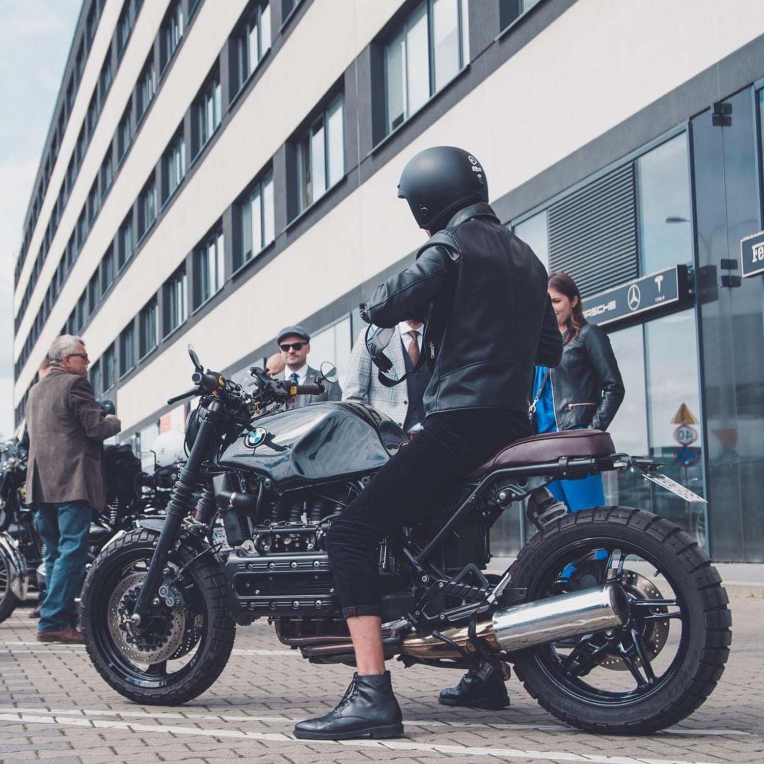 Rider waiting at the kerb on a BMW K-series brat tracker